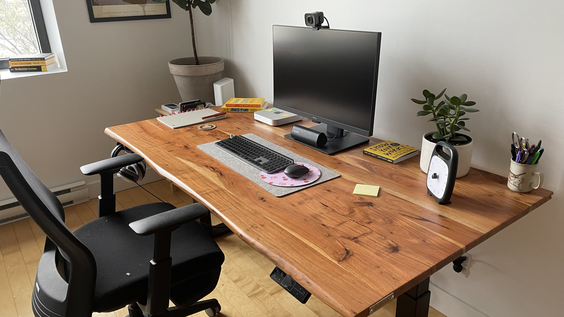 An image with caption: Up close shot of my desk setup.