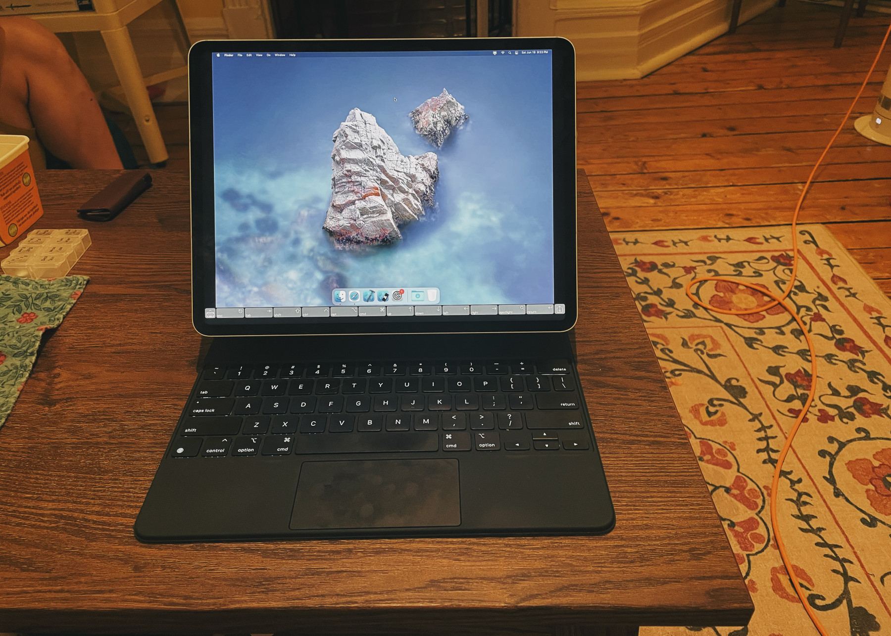 An image with caption: Picture of my iPad Pro accessing a screen share of my Mac Mini.